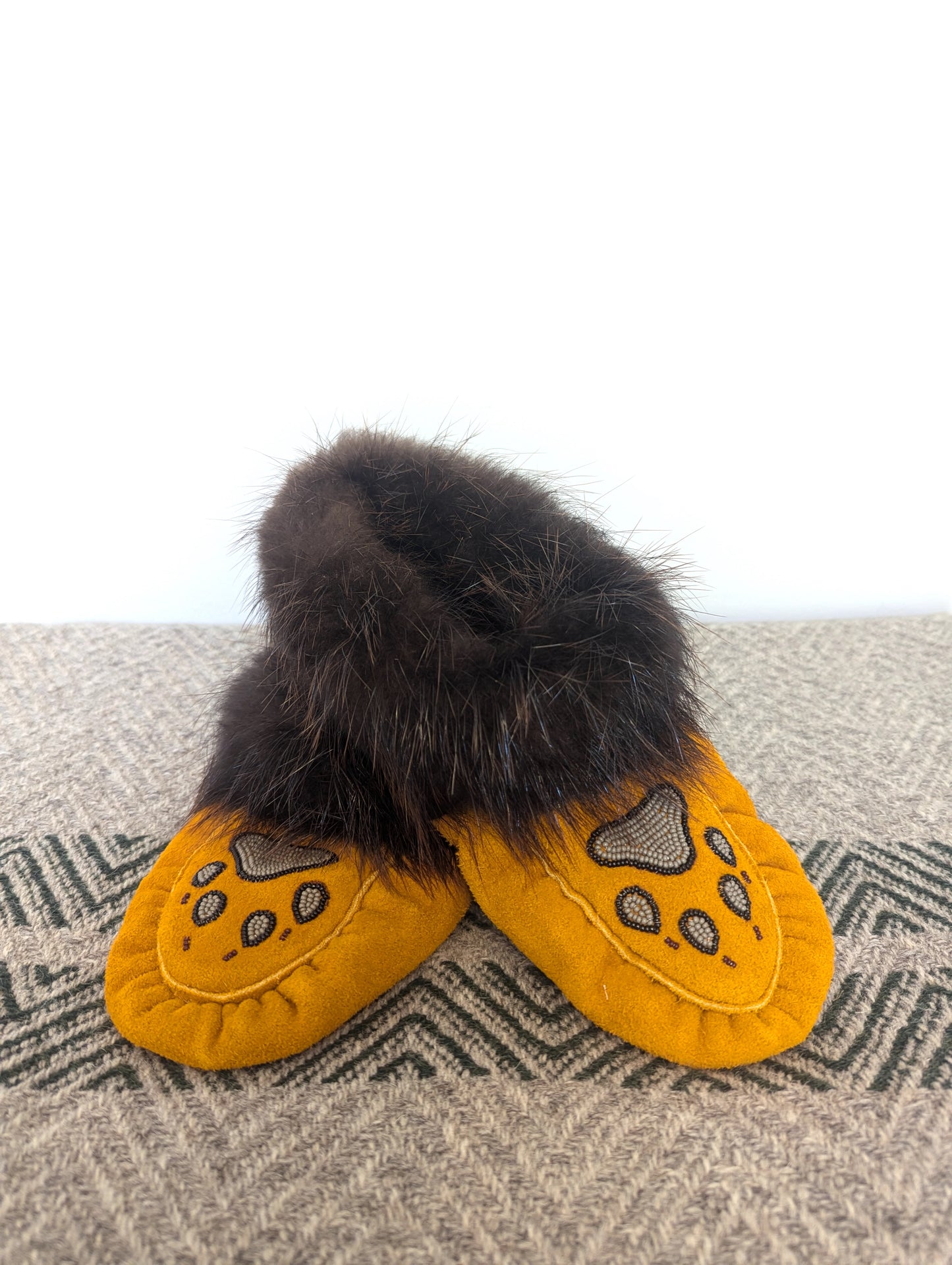 Men's wolf paw moosehide moccasins with beaver fur